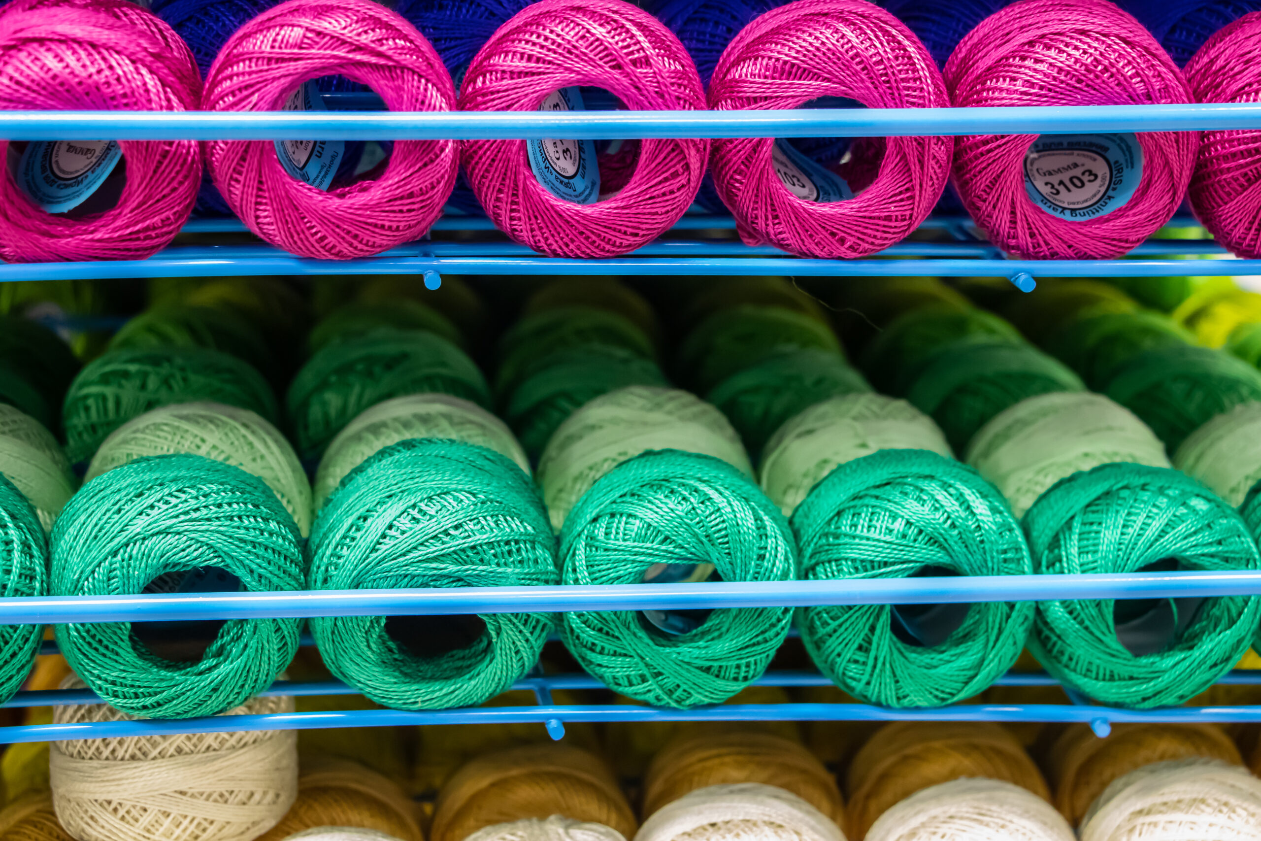 Set of multi-colored threads for embroidery and knitting. Selling sewing supplies in a hobby store.